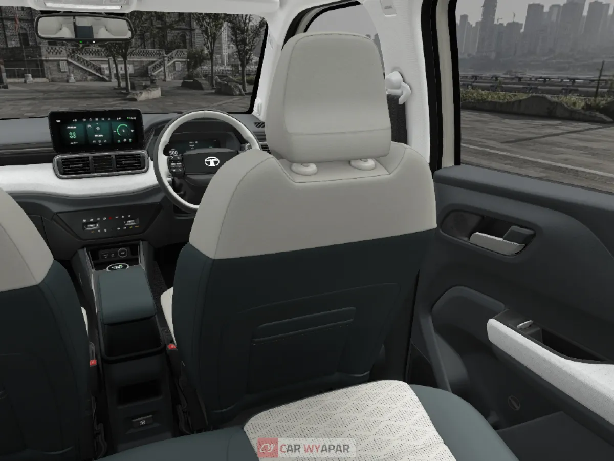 Interior view from the rear seat showing the dual-tone cabin and dashboard of the Tata Punch.ev.